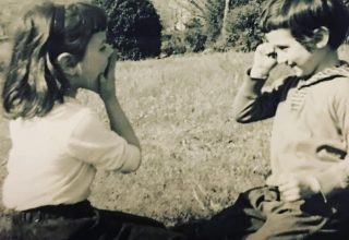 Paula and Linda digging up fishing worms 1950s